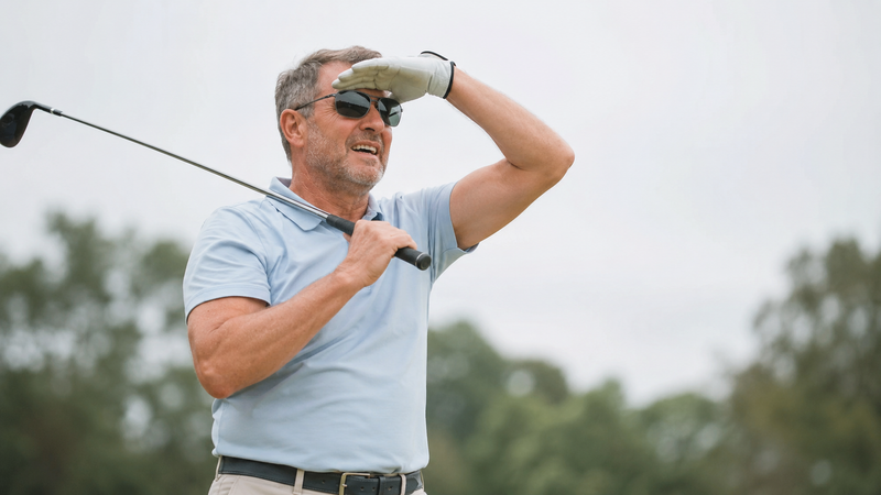 Golfer losing ball in changing light